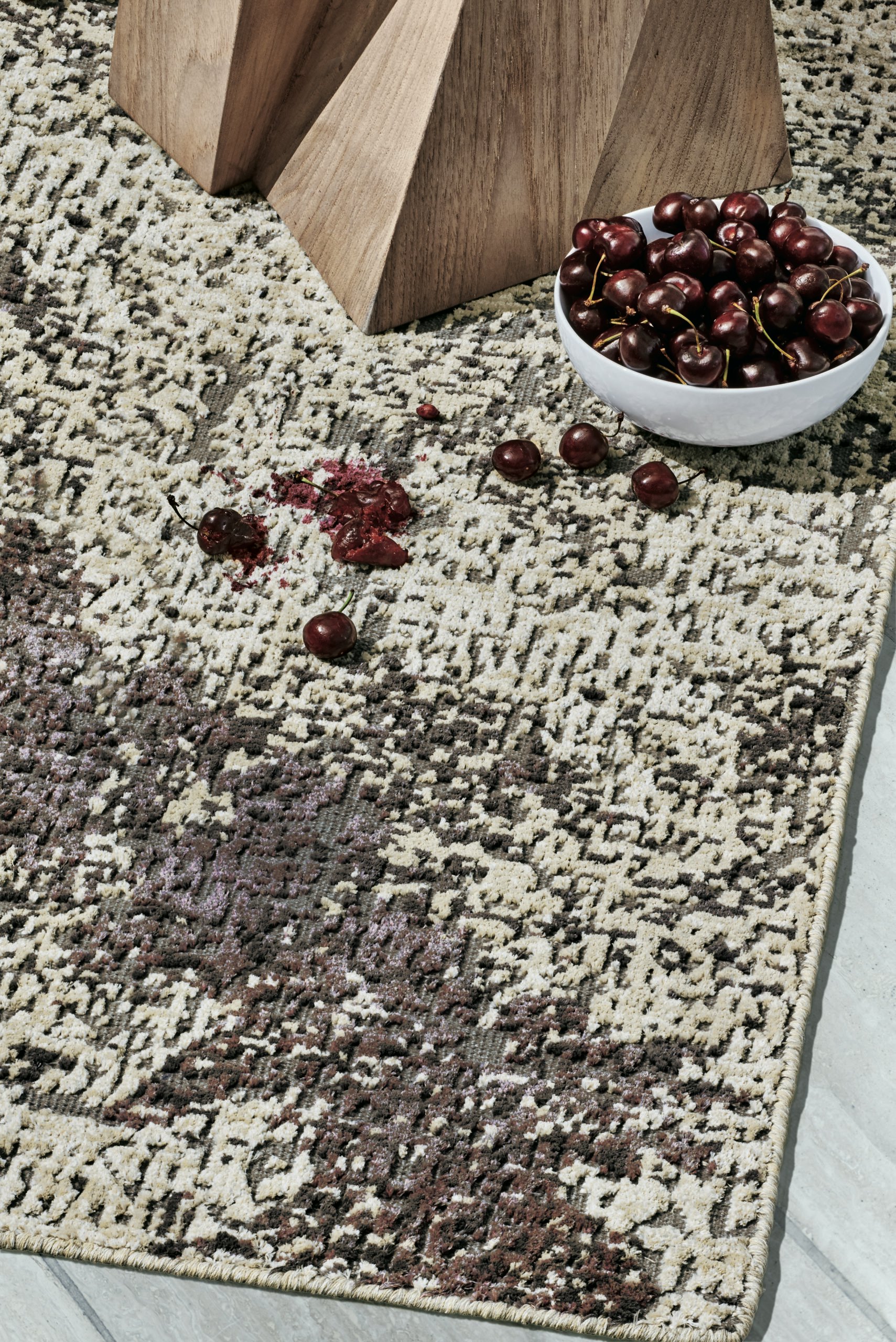 Perennials' Weitzner rug with cherry stains.